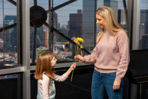 Mother and daughter with flowers